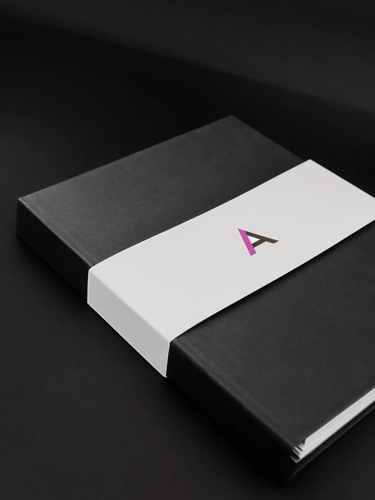 Anarock branded presentation box and notebook with the Anarock A mark on the lid